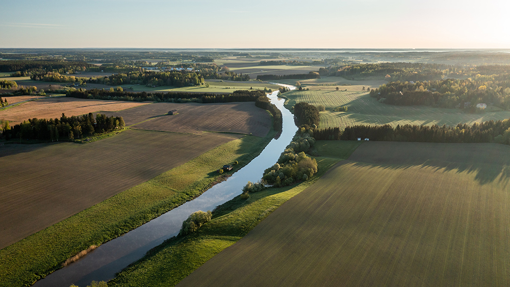 A river running through an agricultural landscape.